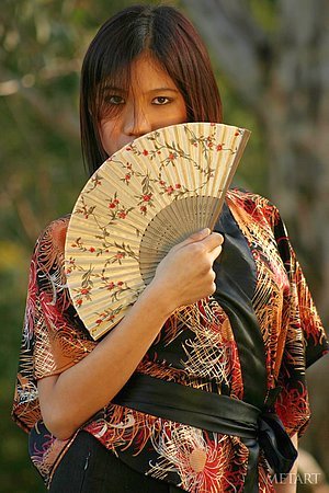 Asian beauty in a traditional outfit shows her insane flexiblity