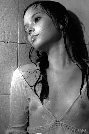 Brunette showing her small boobies in a black and white solo gallery