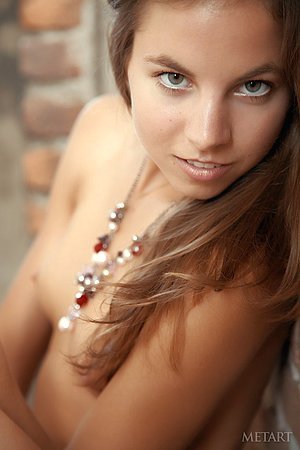 Young brunette hottie in heels posing totally naked in the hallway